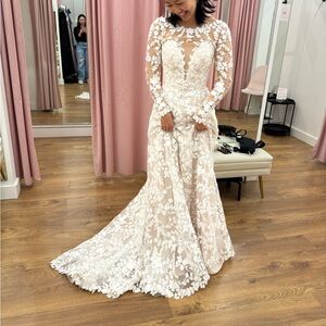 Lillian West 66188
Cotton lace gown with open back and detachable long sleeves